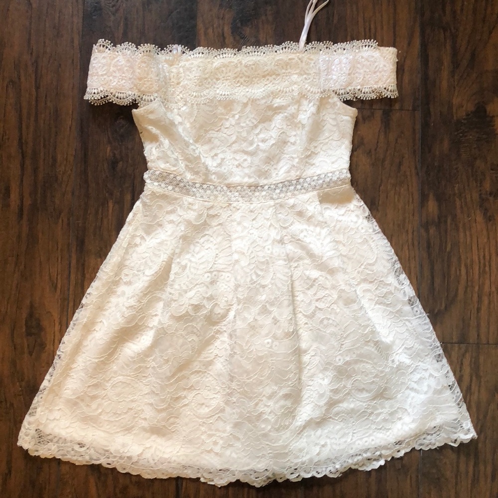 Francesca’s Lacey white off the shoulder dress.